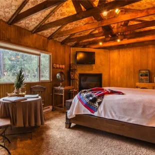 Master suite with king bed and fireplace