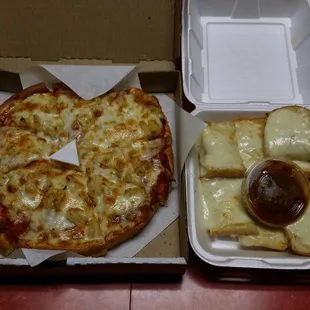 Canadian Bacon and Pineapple pizza and cheesy bread with garlic..