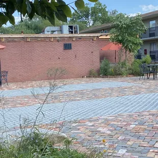 More of the court yard taken by the BBQ that don't work more weeds