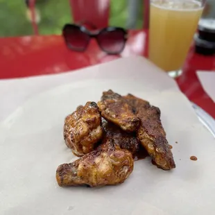 Applewood Smoked chicken Wing  and beer.