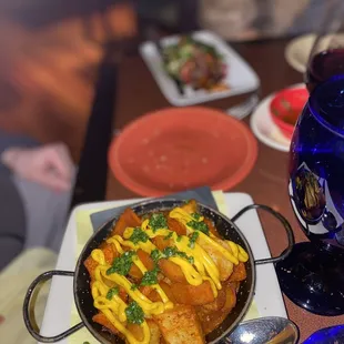 Patatas Bravas and octopus in the back