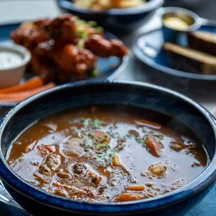 a bowl of soup on a plate