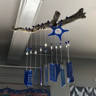 Local artisan Tom Heppel makes wind chimes out of repurposed wood and glass. Available at the Thrive handmade &amp; local shop.