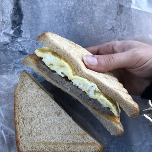 Egg and sausage sandwich on wheat bread