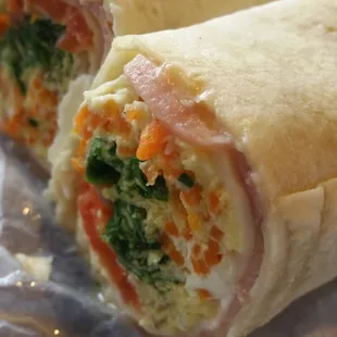Omelet Wrap - eggs, ham, tomato, carrots, spinach, swiss cheese and red onion.