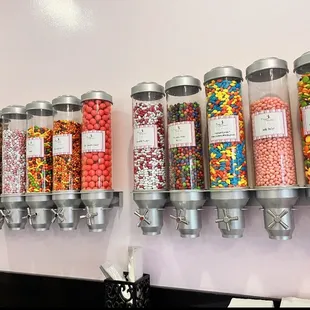 a row of candy dispensers