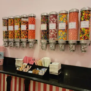 a row of candy dispensers