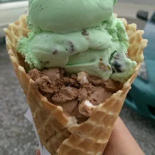 Pistachio and rocky road in a waffle cone