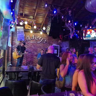 a group of people at a bar