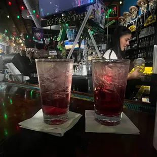 two cocktails on a bar