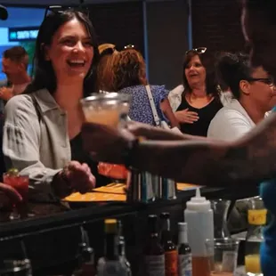 a bartender serving a customer