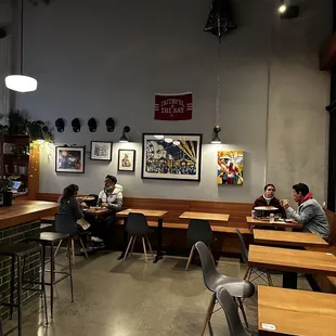 people sitting at tables in a restaurant