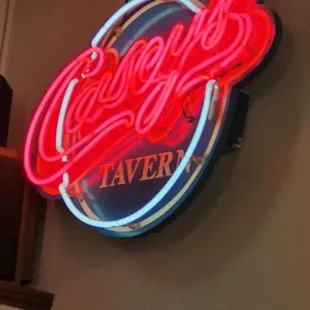 a neon sign on the wall