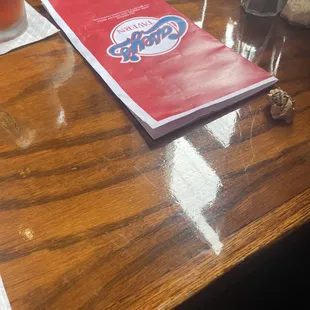 a menu on a wooden table