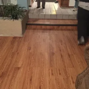 a man and a woman walking into a house