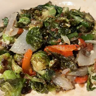 a plate of brussels sprouts and carrots