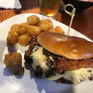 Mushroom Swiss burger with bacon and tots