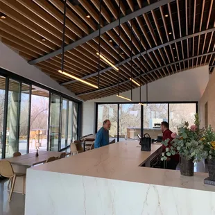 two people sitting at the bar