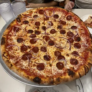 Large pizza with pepperoni and onion