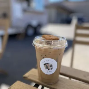 a cup of coffee on a wooden table