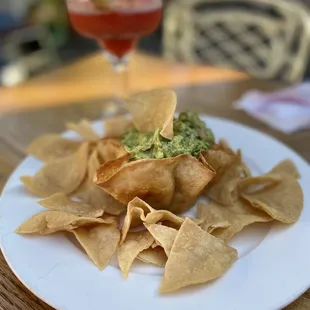 a plate of tortillas with guacamole
