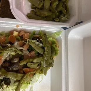 Nopales ( cactus paddles) on a huaraches ( I&apos;m assuming vegan because I asked no cheeses and no sour cream)