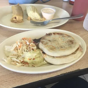 Papusas in front. Corn tamale in back/right. Pork tamale back/left. White cream is a little sour like Greek yogurt minus 10.