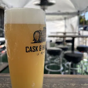 a glass of beer on a table