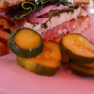 a sandwich and pickles