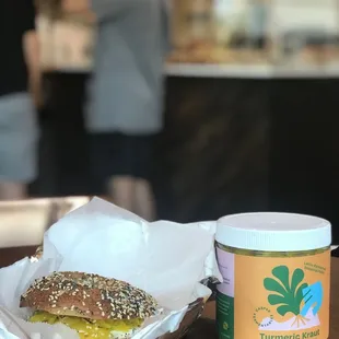 a sandwich and a jar of peanut butter