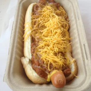 Chili, cheese, mustard, relish, chopped tomato and Onion.