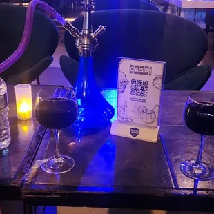 a glass of wine and a hook