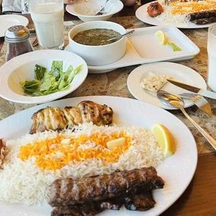 Chicken, steak, ground beef kebabs, Persian dugh, soup, salad, bread, tea, bamieh, zoulbiah.