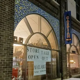 a view of a storefront at night