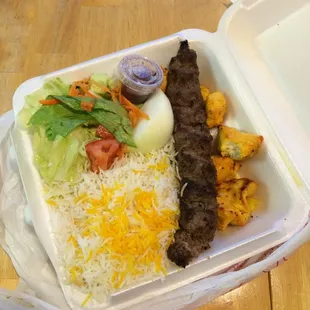 Caspian combo (chicken and ground beef) w/ half rice-half Delicious! Preferred the beef. Came with yogurt sauce and pita