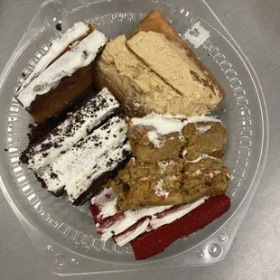 Cake trimmings bought off of the "too good to go" app. Carrot cake, chocolate cake, red velvet cake and some others.