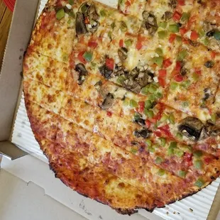 Pizza partially topped.