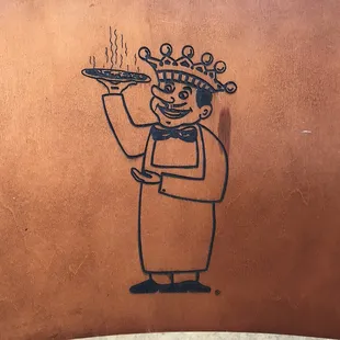 a chef holding a pizza