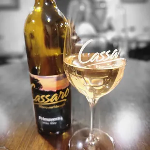 a glass of wine and a bottle of wine