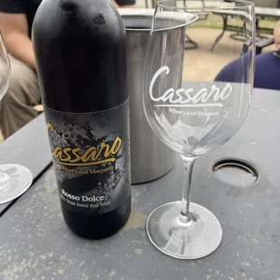 a glass and a bottle of wine