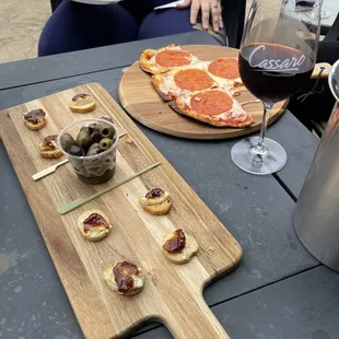 a pizza and a glass of wine