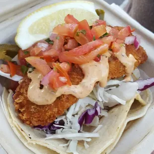 fish tacos in a styrofoam container