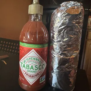 For comparison, a Tabasco Sriracha bottle next to the carne asada super burrito