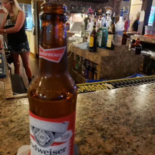 a beer bottle on the bar