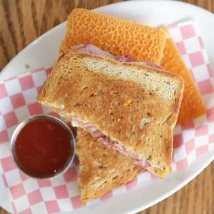 Deli ham w/ your choice of cheddar or swiss cheese. Served w/ mayo &amp; mustard &amp; house tomato jam.
