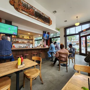 customers sitting at the bar