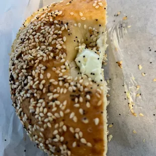 a sesame bagel with butter