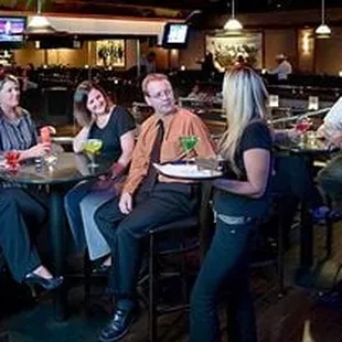a group of people sitting at a table