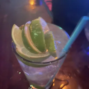 a drink with lime slices