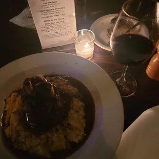 5/19/2023 - braised pork shank over herbed polenta with a glass of Sohm &amp; Kracher Gruner Veltiner